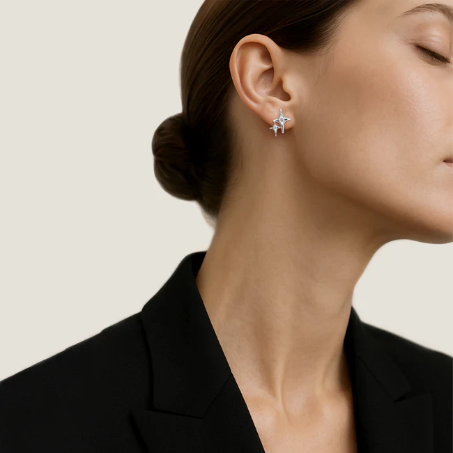 Diamond star stud earrings in white gold on model, minimal luxury jewellery styling