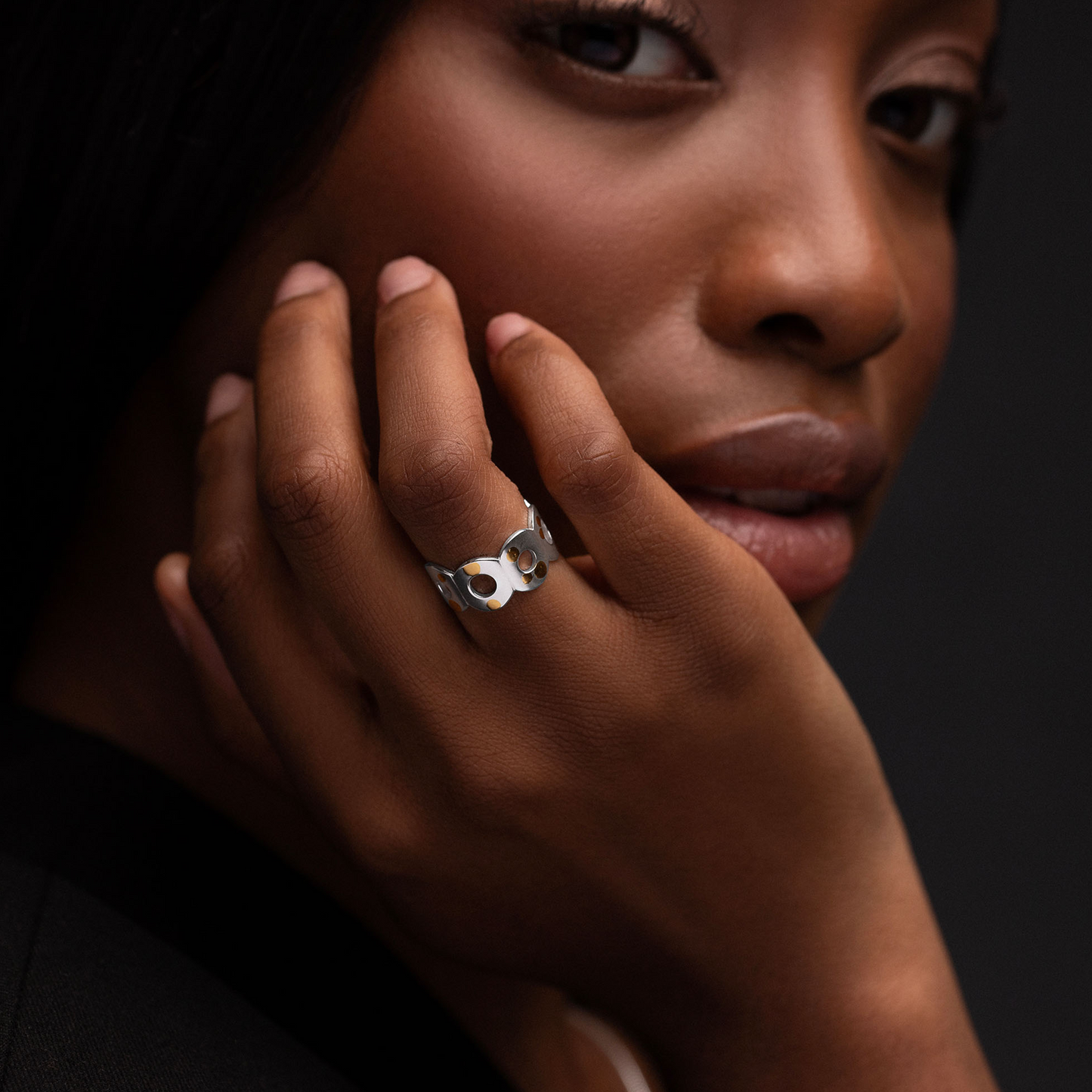 Model wearing the Kairoi Ring by Isabella Bedford in sterling silver and 24ct gold