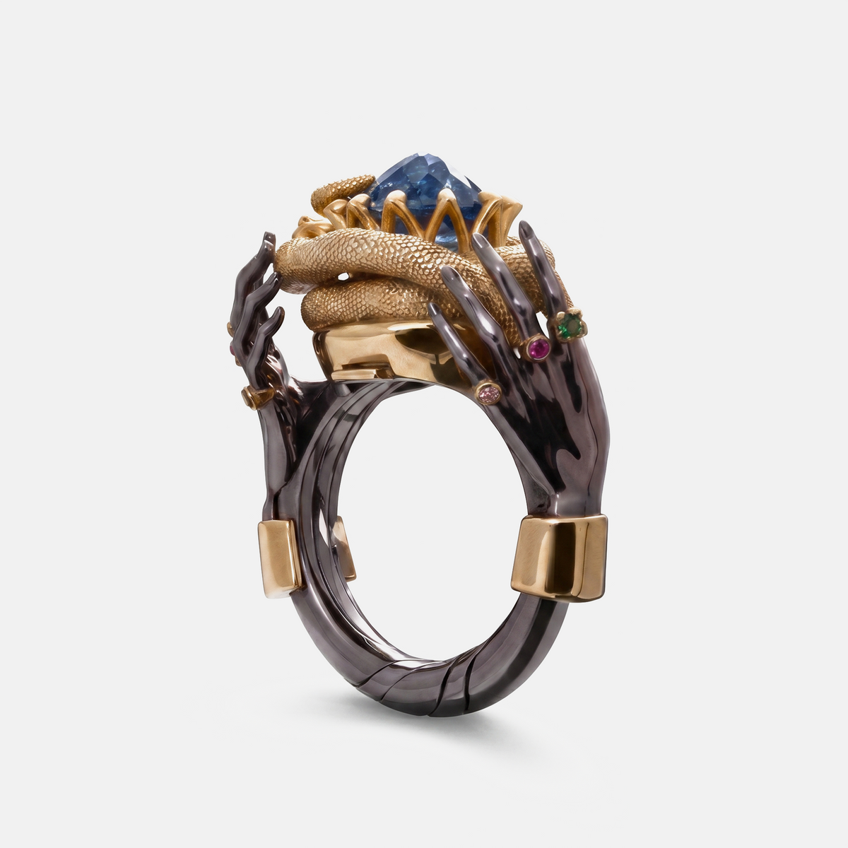 Luxury designer ring with blue gemstone and gold snake detail, sculptural hand ring statement jewellery