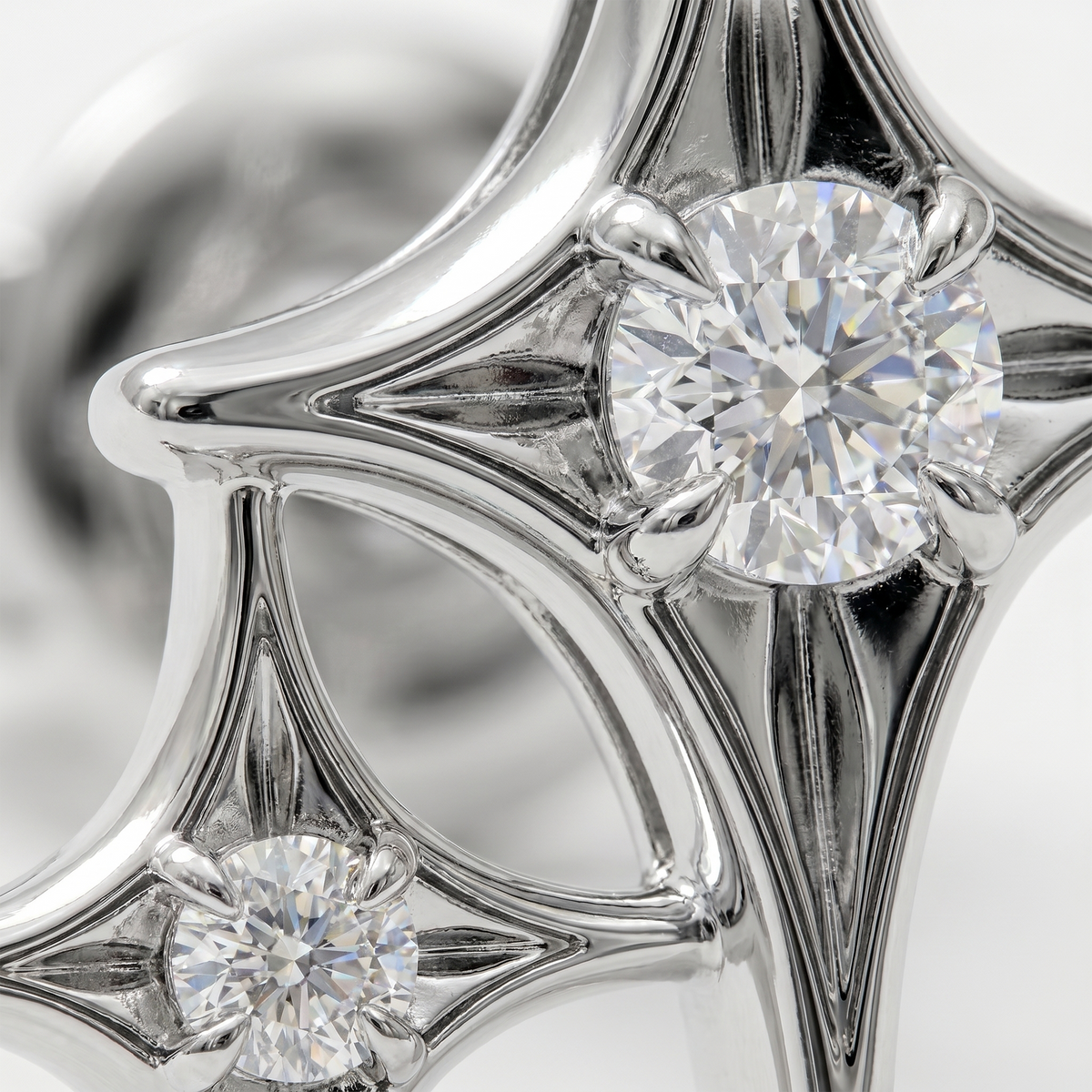 Close-up diamond star earrings in white gold, fine jewellery detail with brilliant cut diamonds