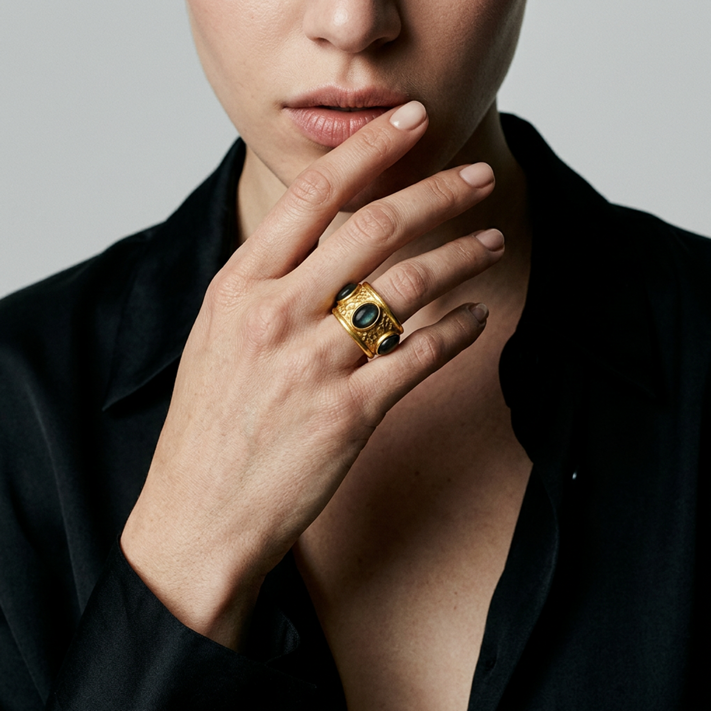 Contemporary textured gold ring with black stones