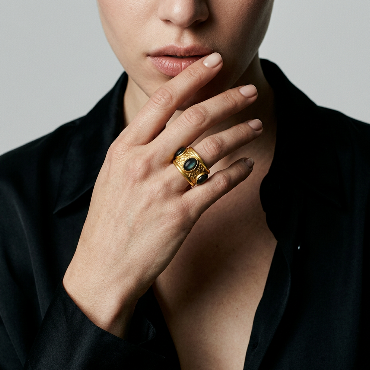 Contemporary textured gold ring with black stones