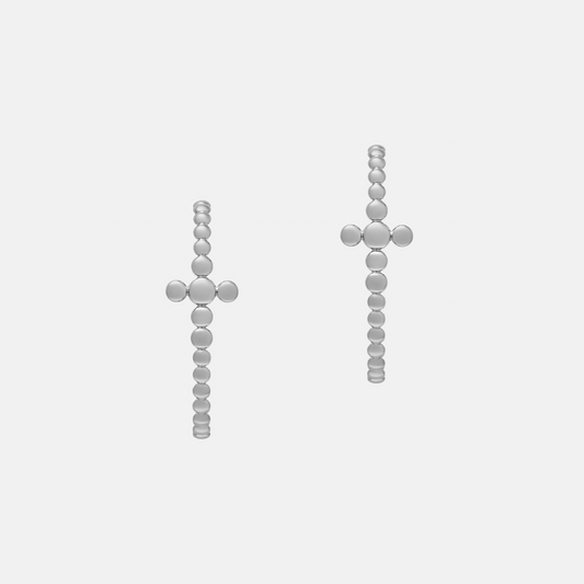 A pair of silver beaded cross earrings on a light gray background.