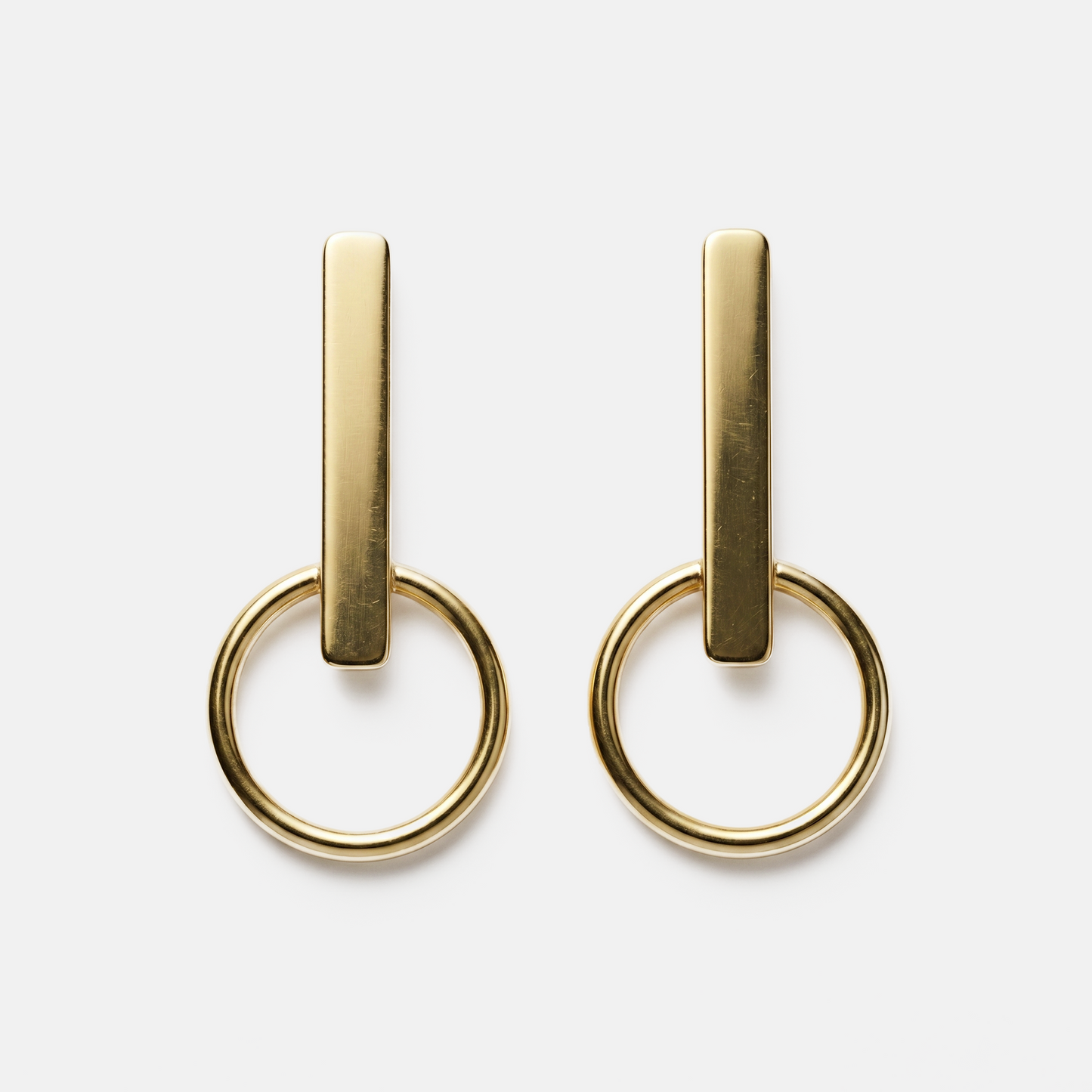 Orbit gold statement earrings with geometric design