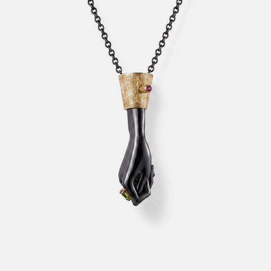 Black gold hand pendant necklace with ruby and green gemstone, designer statement jewellery, luxury unique pendant