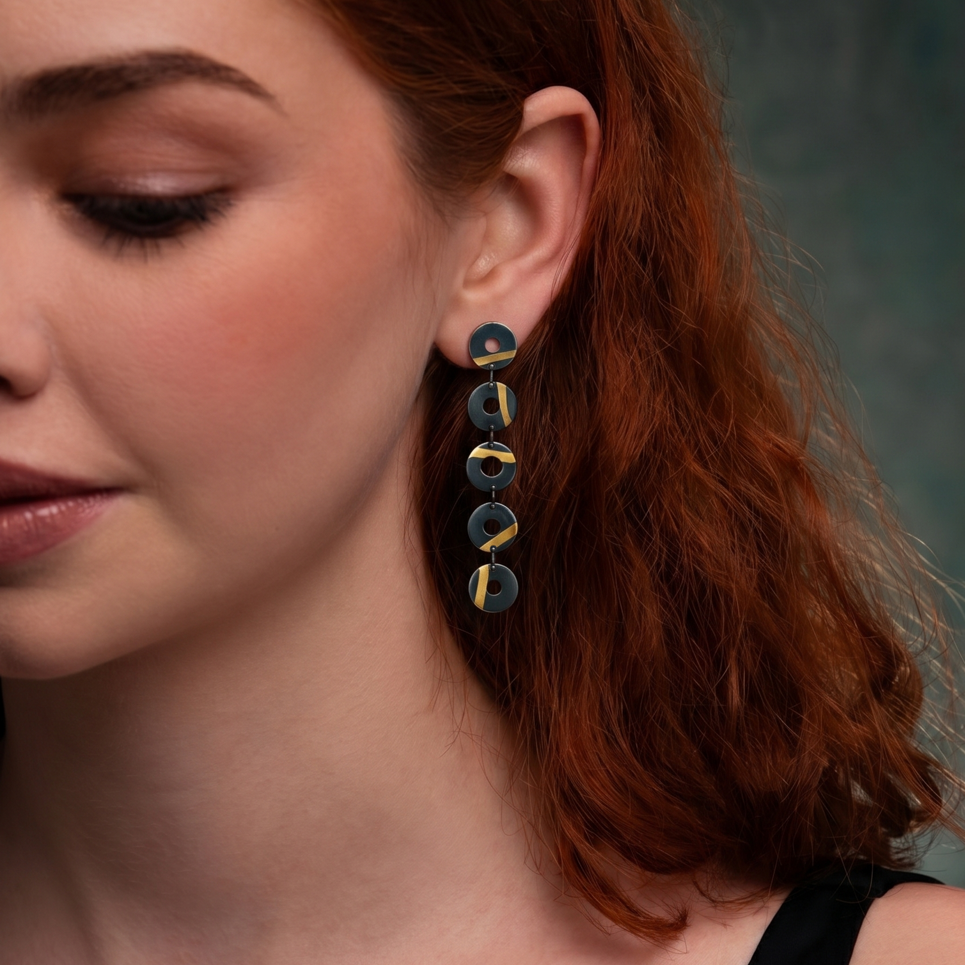 model wearing designer earrings