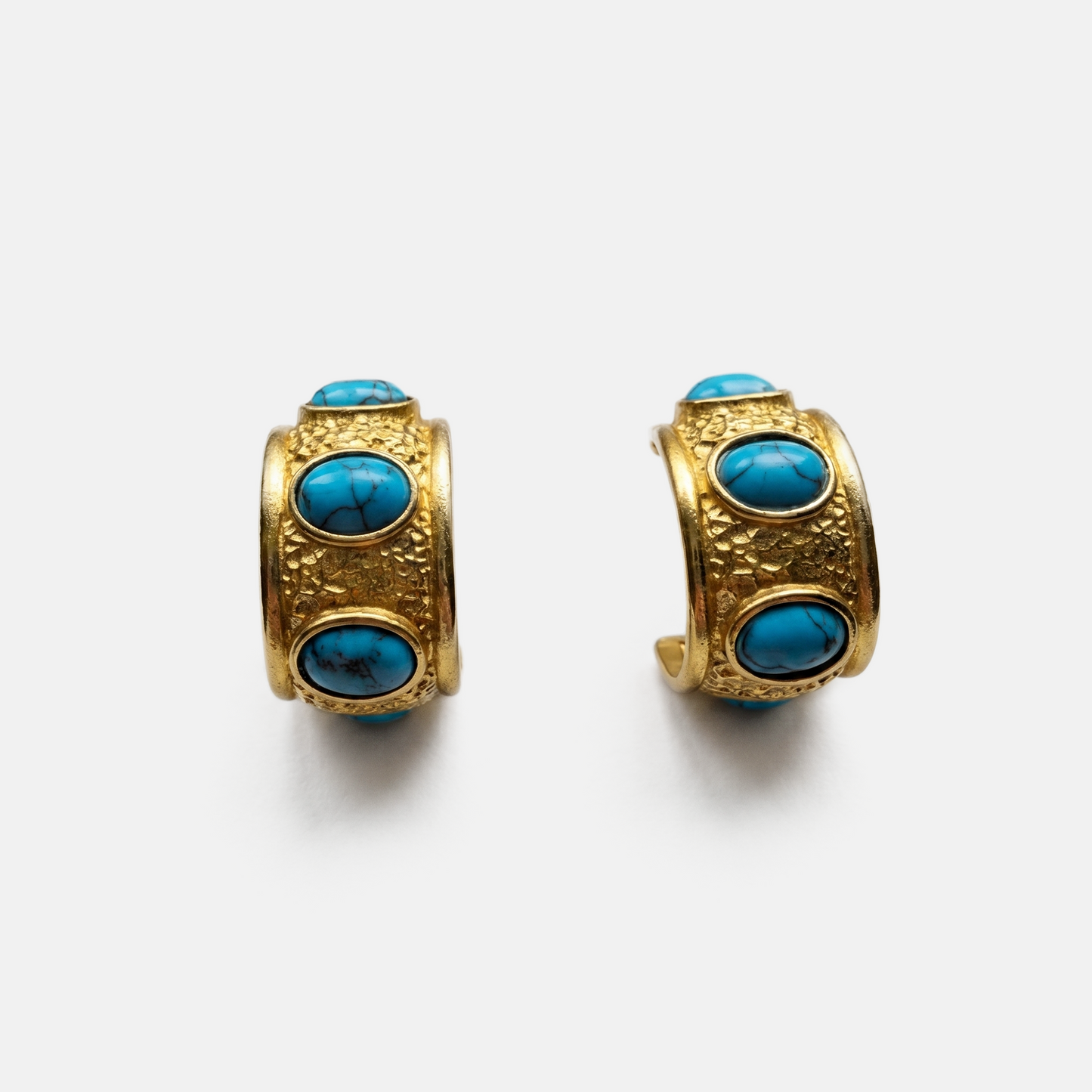 Sculptural gold huggie earrings with natural turquoise stones