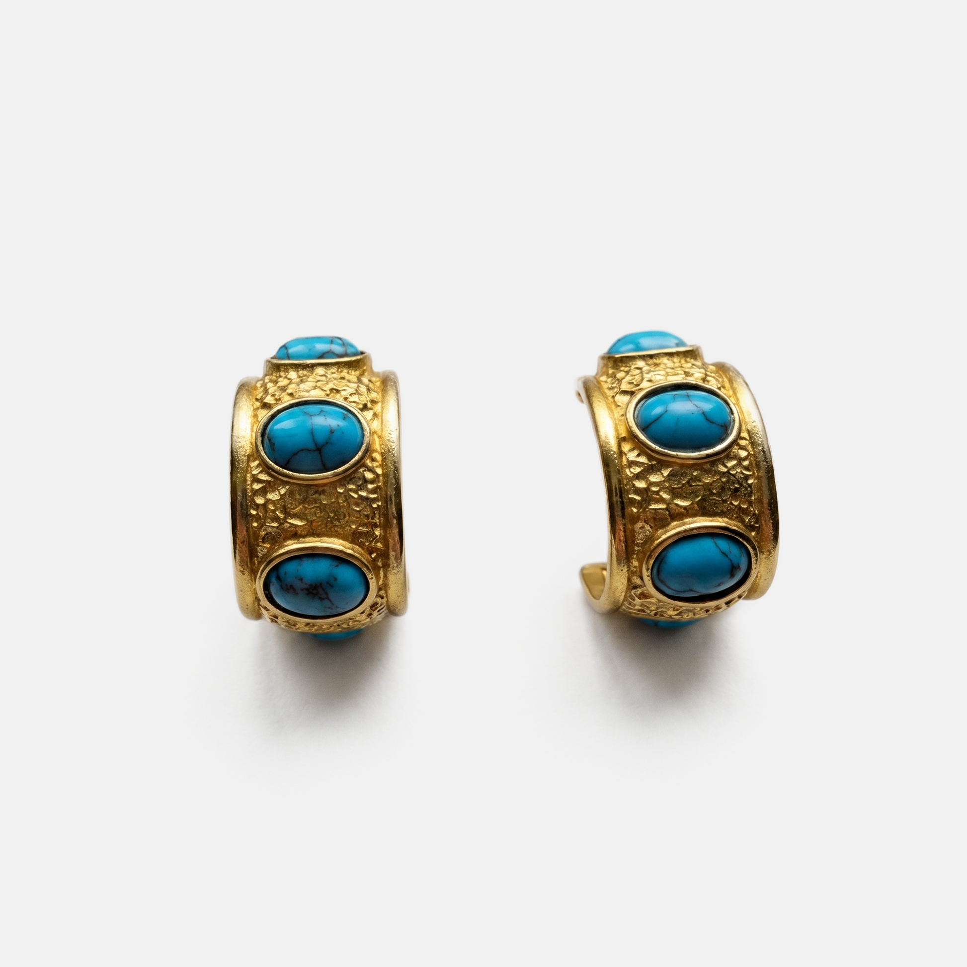 Sculptural gold huggie earrings with natural turquoise stones