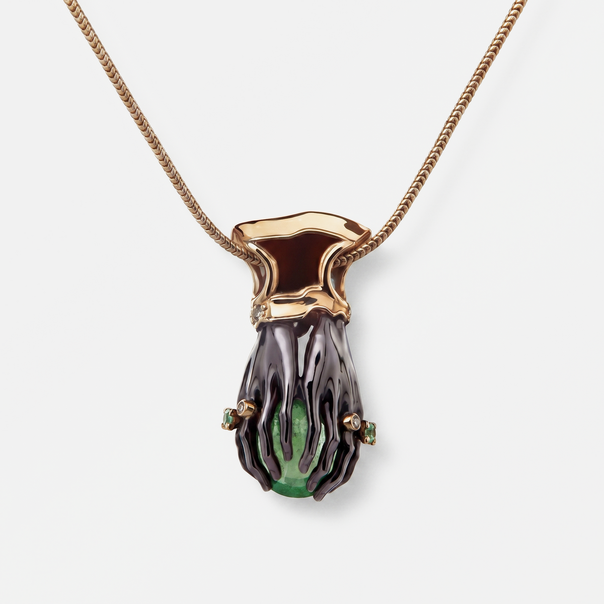 Necklace with a unique pendant featuring a green gemstone on a white background