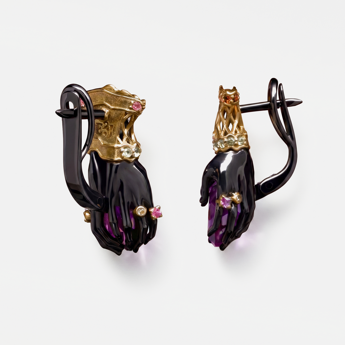 Side view of luxury amethyst earrings with sculptural hand design, gold and black metal setting, high-end designer jewellery detail