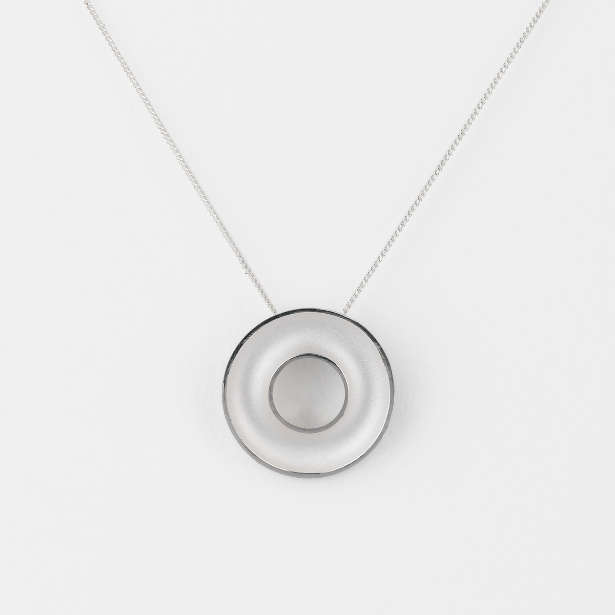 Necklace with a round pendant on a white background
