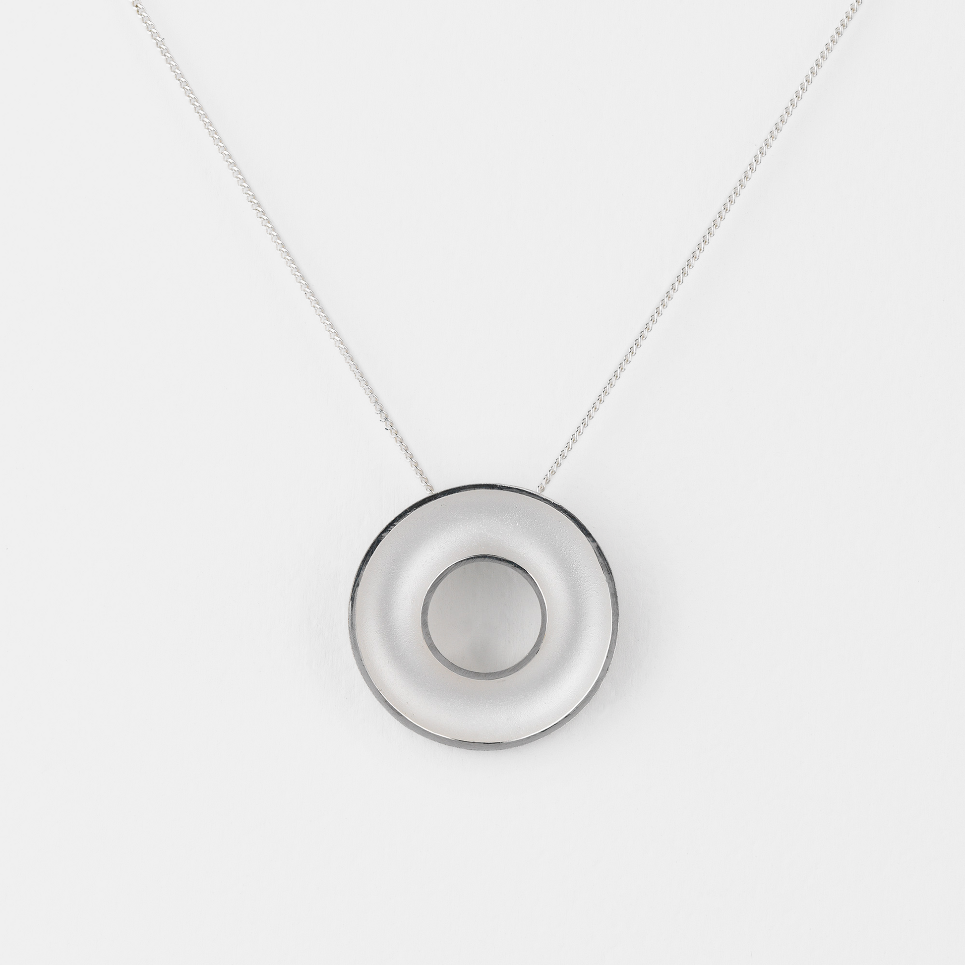 Necklace with a round pendant on a white background