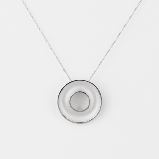 Necklace with a round pendant on a white background