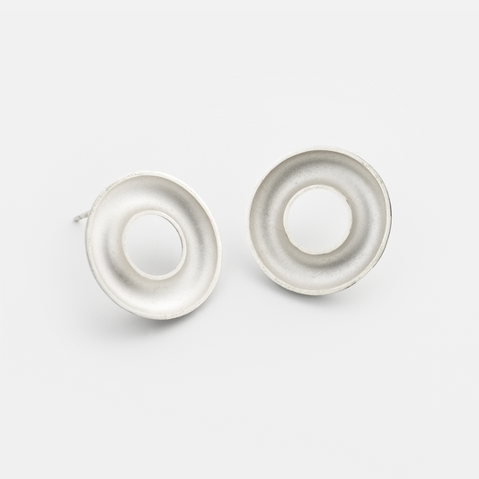 Handmade Orbis Medium Sterling Silver Stud Earrings featuring a sculptural 20 mm concave torus design with polished finish. Contemporary designer jewellery handcrafted in Glasgow.