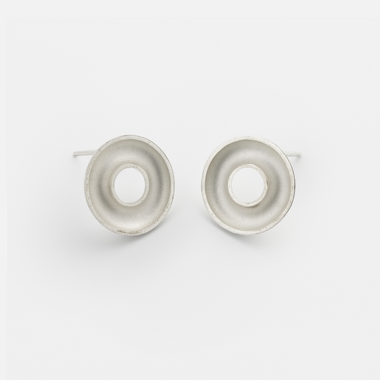 Handmade Orbis Small Sterling Silver Stud Earrings featuring a sculptural concave torus design with polished finish. Contemporary minimalist jewellery handcrafted in Glasgow.