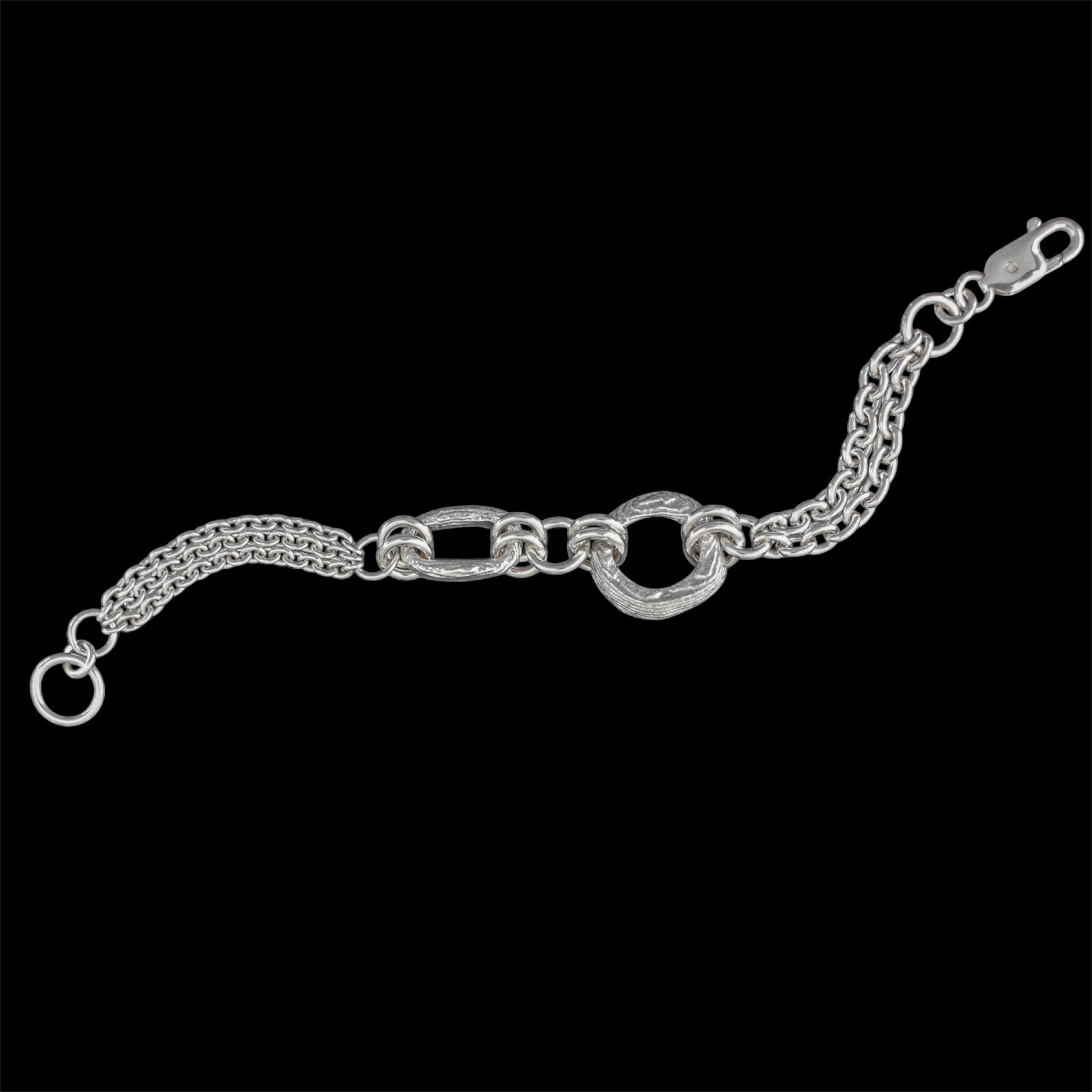 Silver chain bracelet on a black background