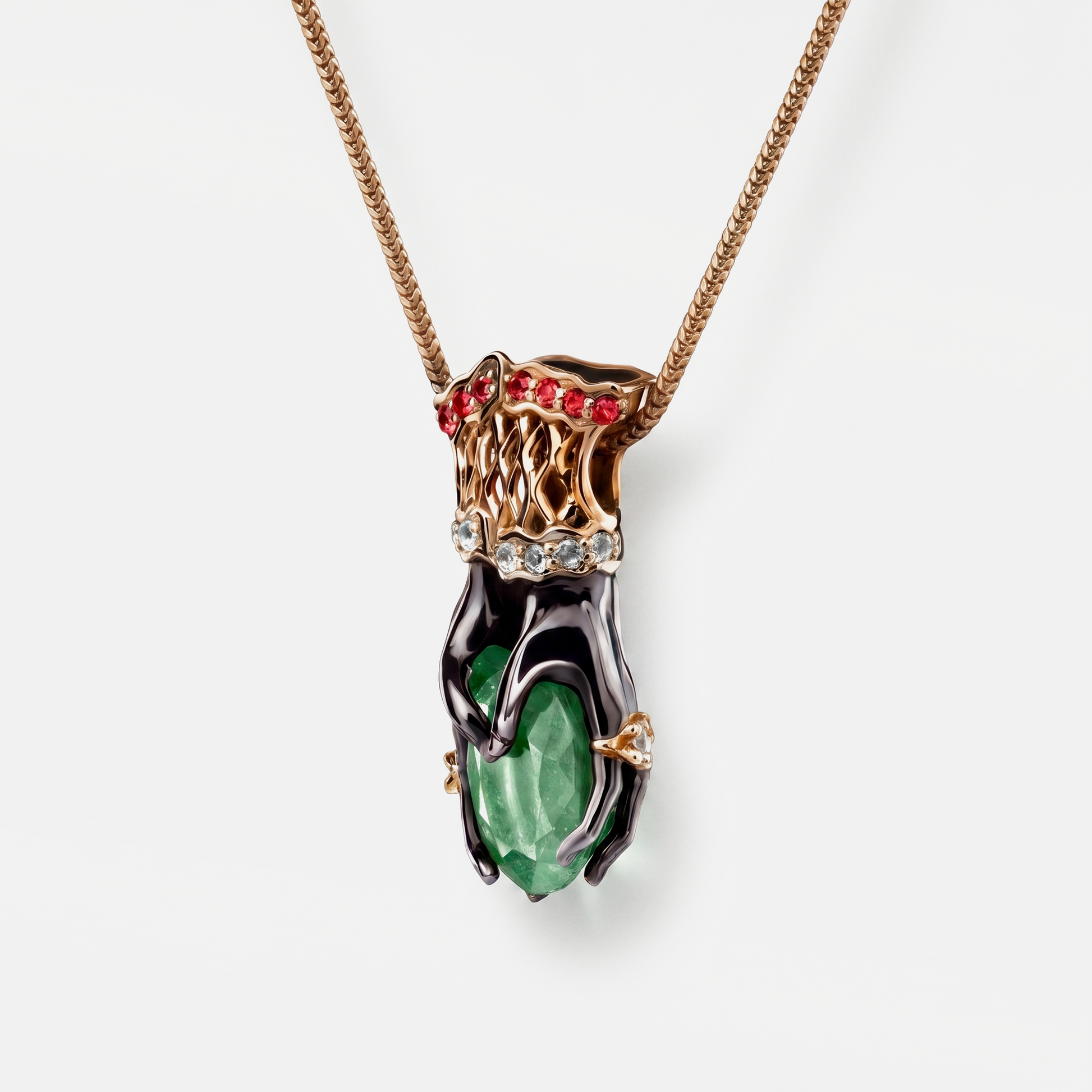 Luxury pendant necklace with green gemstone and red stones on a white background