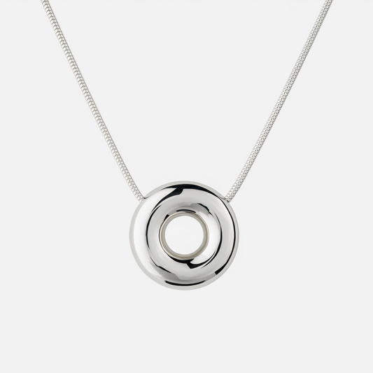 Handmade Statement Monad Sterling Silver Necklace featuring a polished sculptural torus pendant on a sterling silver snake chain with chunky hook clasp.