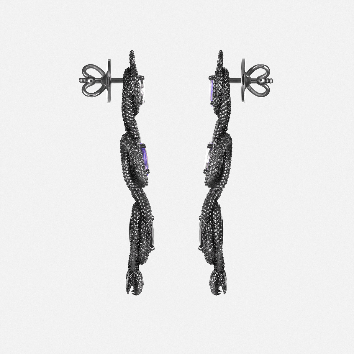 Side view of snake-inspired dangling earrings with oval gemstones, contemporary sculptural jewellery
