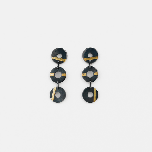 Chronos Trio oxidised sterling silver drop earrings featuring three articulated torus links with 24ct gold keum-boo detailing.