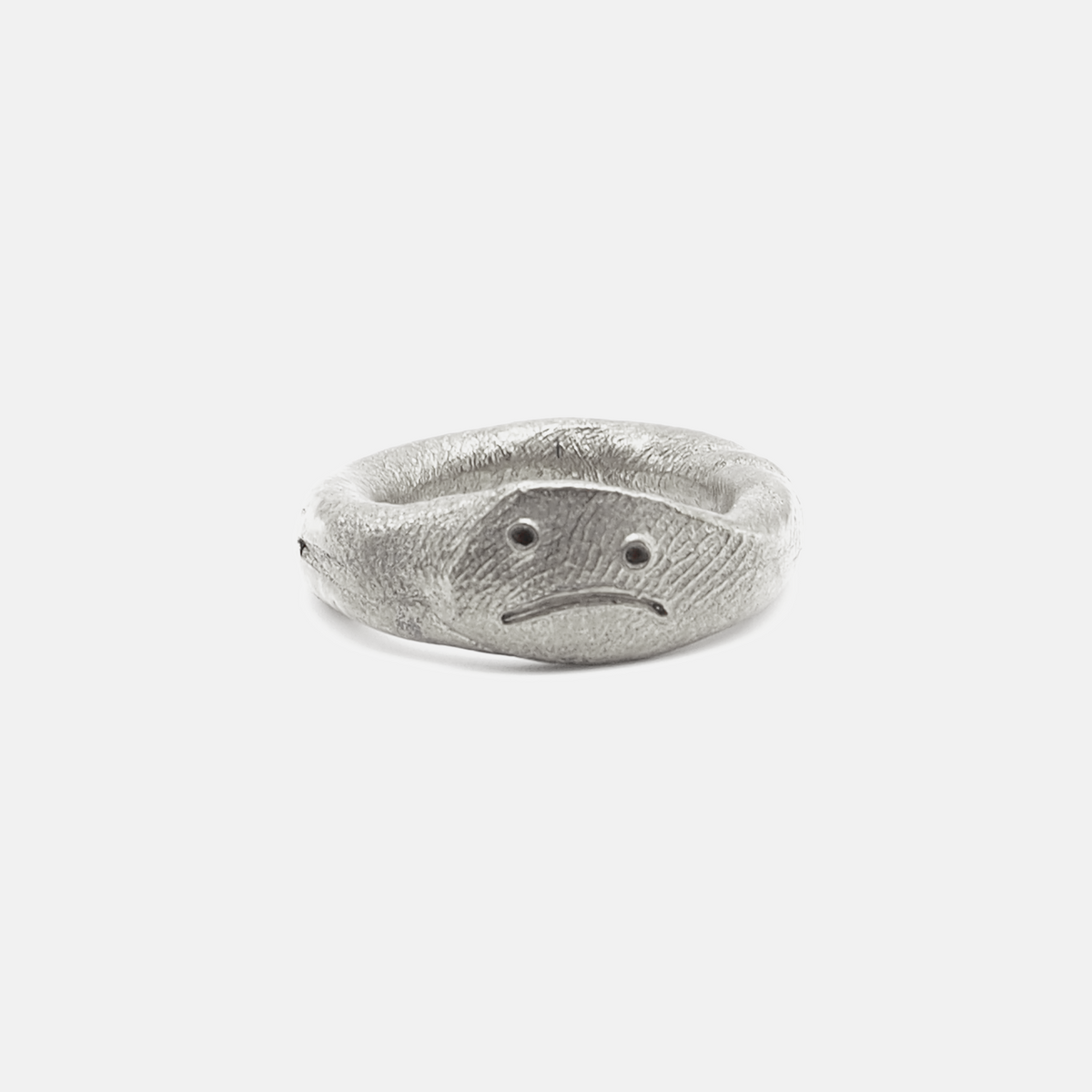 Silver ring with a textured design on a white background