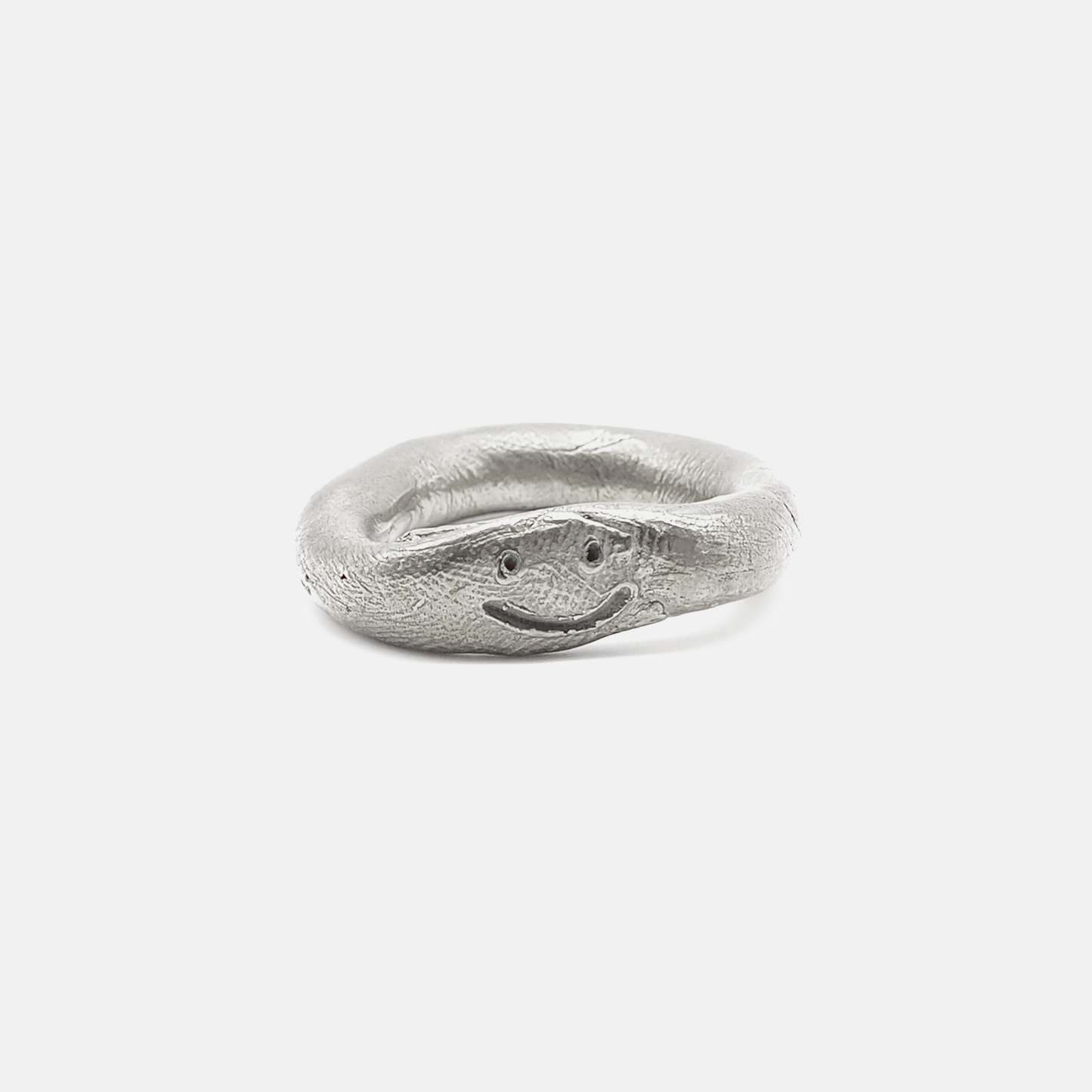 Silver ring with a unique design on a white background