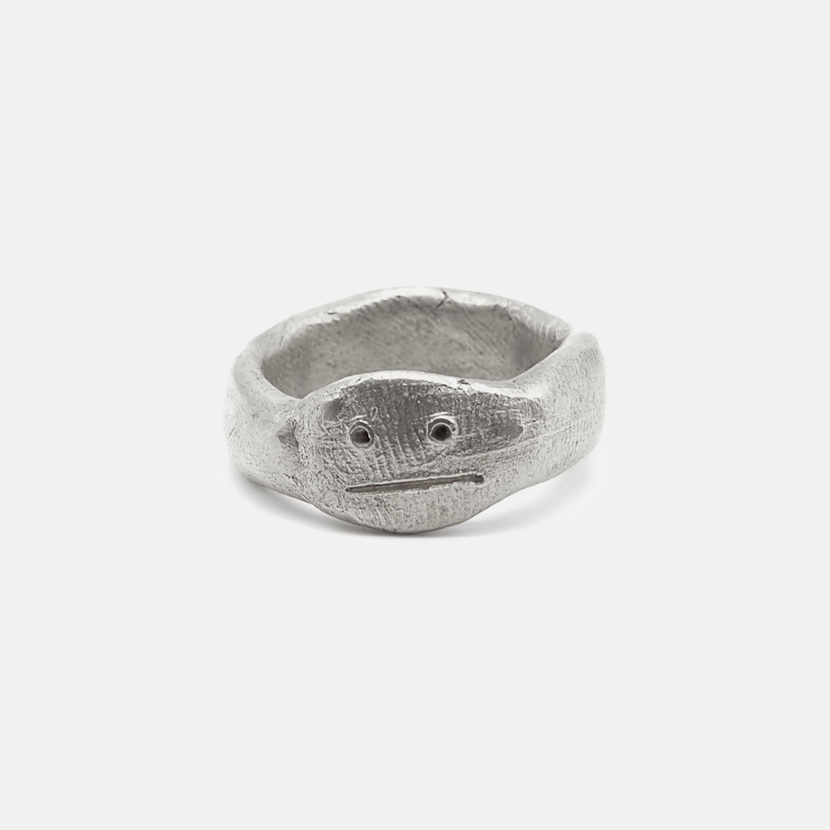 Silver ring with a textured design on a white background