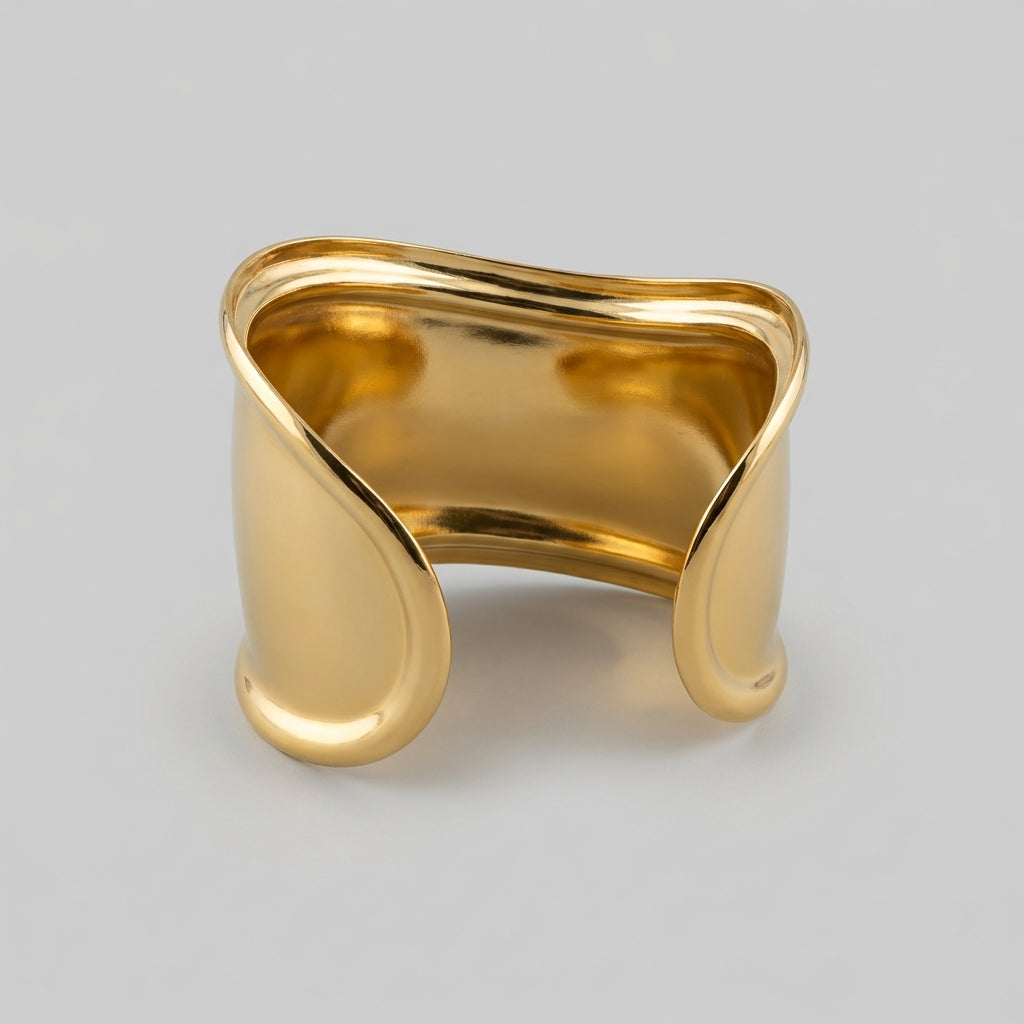 Gold bracelet displayed on a light gray background