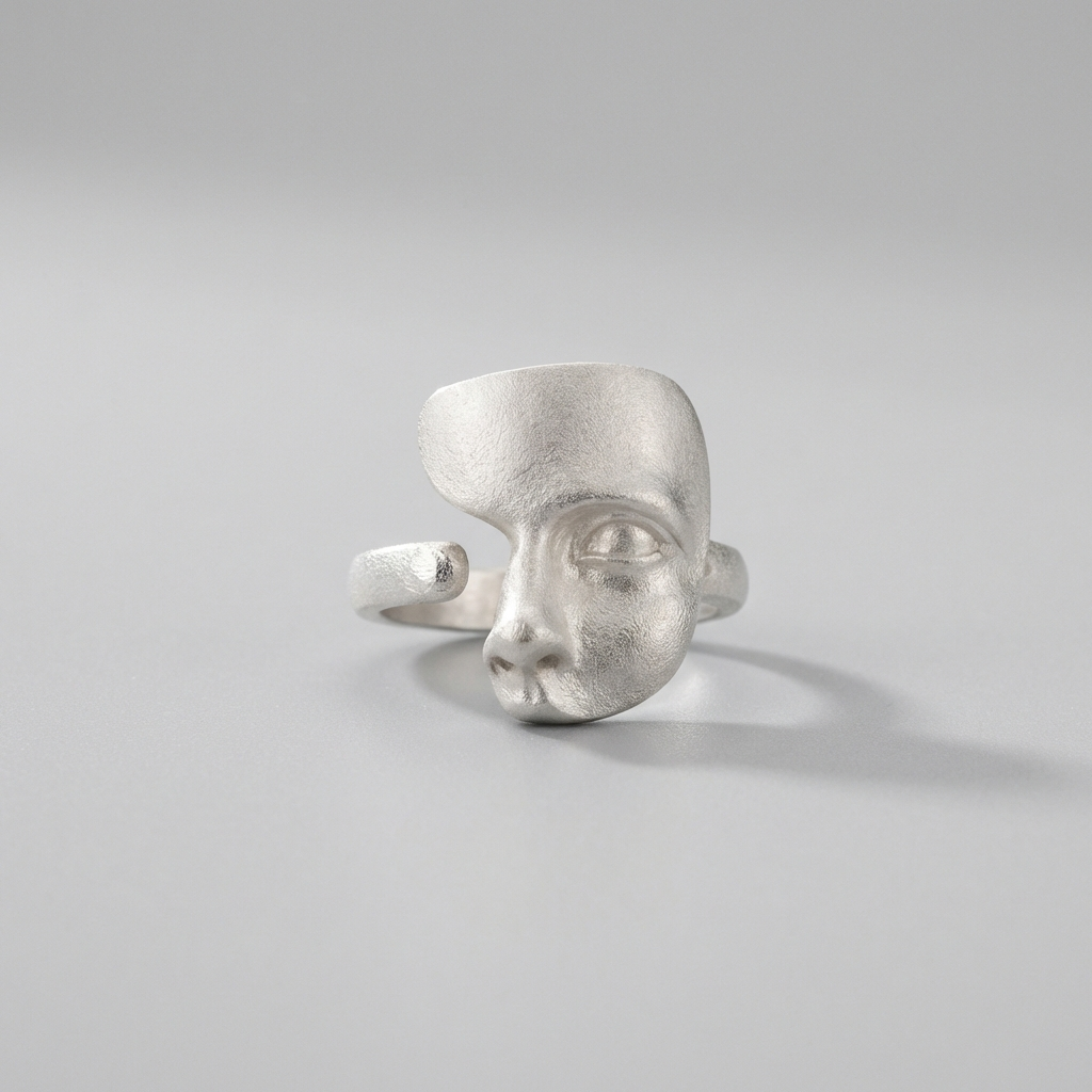 artistic sterling silver ring sculptural face design modern jewellery close up
